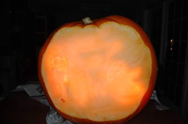 Pumpkin carved 2015 as the Wicked Witch of the West, with three layered images visible: the witch's face, the hourglass, and the candle.